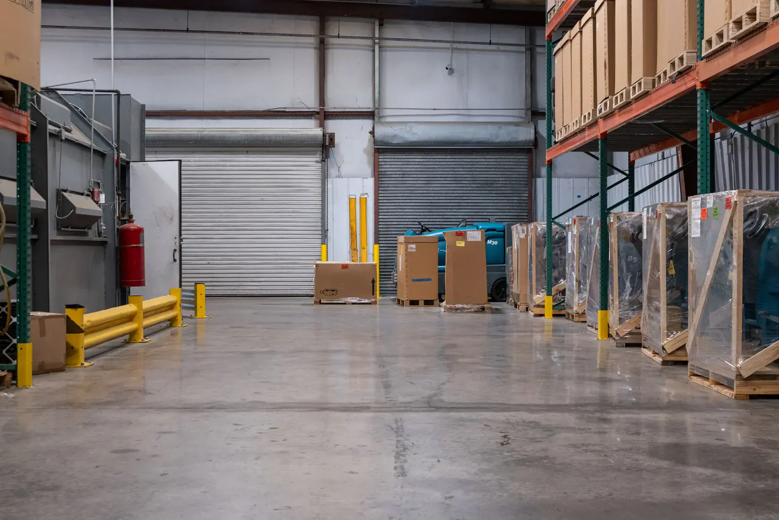 Row of crated machines at the SES loading dock