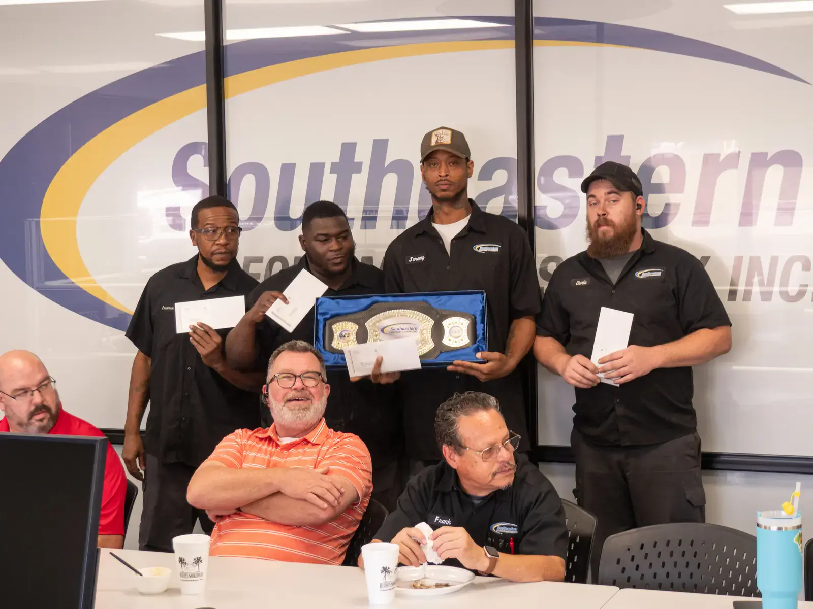 SES technicians with their Technician of the Month award